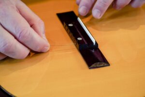 Restring a classical guitar