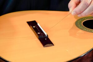 Restring a classical guitar