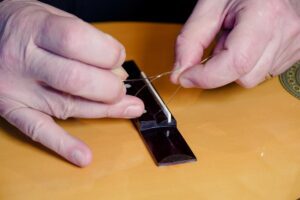 Restring a classical guitar