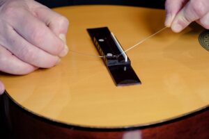 Restring a classical guitar
