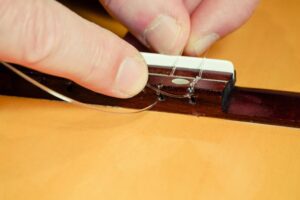 Restring a classical guitar High Wycombe
