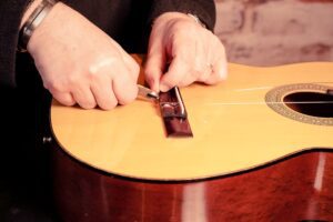 Restring a classical guitar High Wycombe