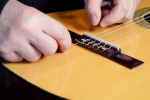Restring a classical guitar High Wycombe