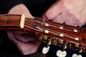 Restring a classical guitar. Local company