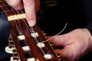 Restring a classical guitar. Local company
