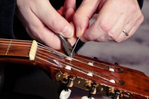 Restring a classical guitar. Local company