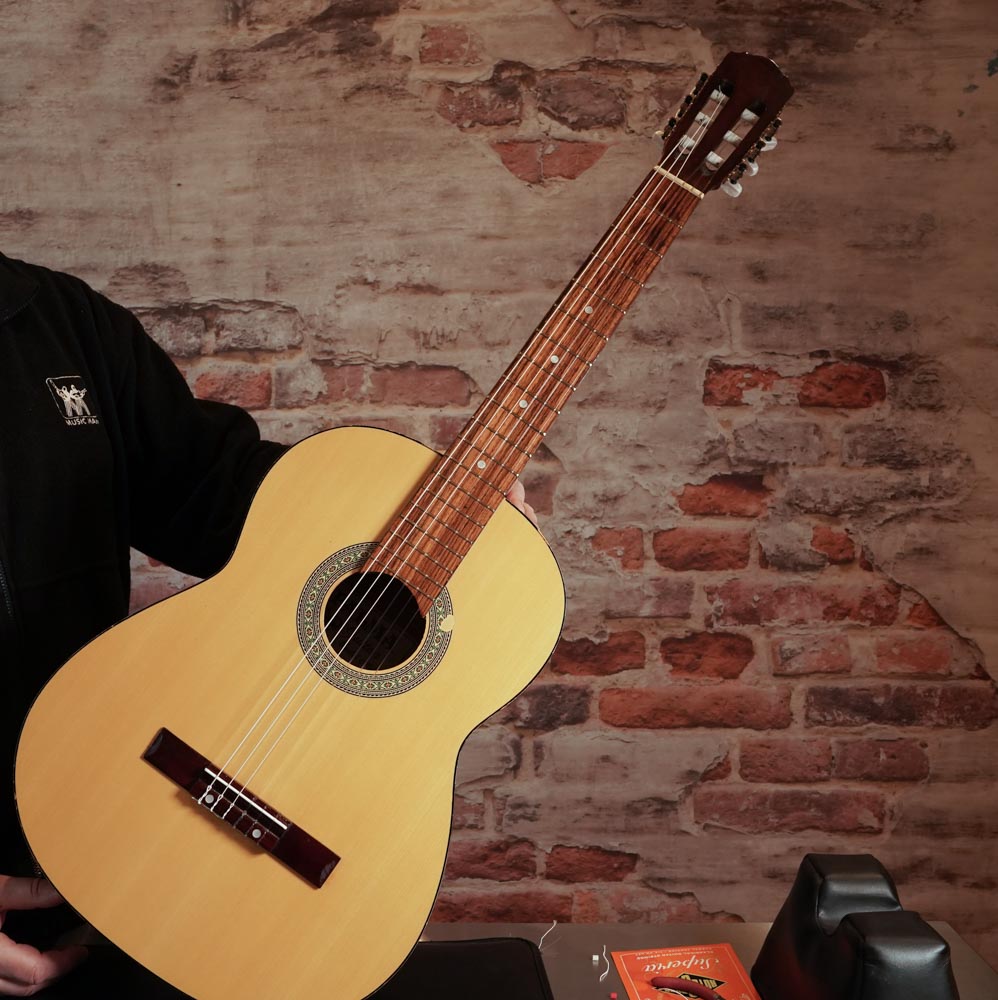 Restring a classical guitar. Local company